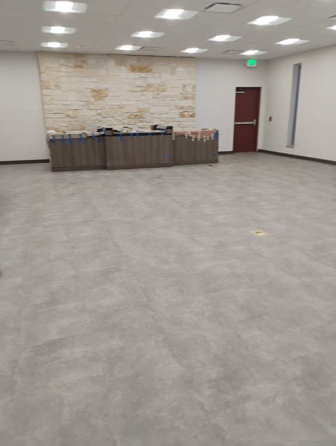 Finished meeting room with stone accent wall